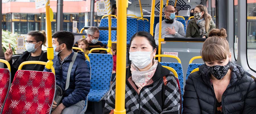 Masked bus passengers